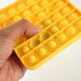 Jeu en silicone éclate-bulles pop anti-stress pour enfant et adulte jaune